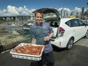 Four Seasons Vancouver Head Chef Ned Bell with fresh spot prawns and his 2015 Toyota Prius V at False Creek Fisherman's Wharf in Vancouver.