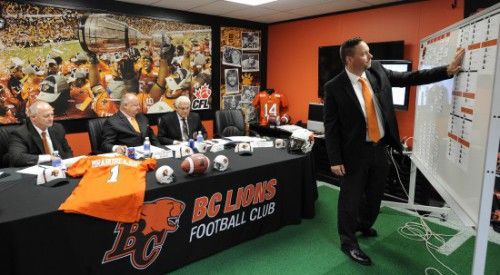 Surrey B.C.  May 12, 2015 The B.C. Lions coach Jeff Tedford, (left)  Dennis Skulsky (c) and G.M. Wally Buono (r) in their 