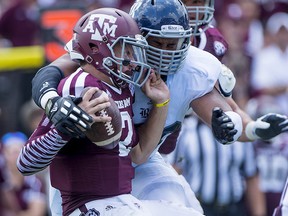Christian Covington, during his sophomore season with the Rice Owls, sacks former Texas A&M quarterback Johnny Manziel. Covington was picked in Saturday's NFL draft by the Houston Texans. (Tommy Lavergne, Rice athletics)