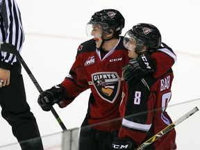 Tyler Benson and Alec Baer celebrate a Giants goal last season. Will they be linemates next year? If so, will they have a newcomer as their centre? Will that player be acquired Thursday? (Getty Images File.)