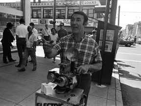 August 1, 1968 photo of street photographer Foncie (Alfronco Pulice) at work at Robson and Granville Street.