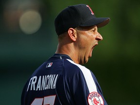 Terry Francona, then manager of the Boston Red Sox, makes no effort whatsoever to stifle a yawn while watching batting practice before the 2005 MLB Home Run Derby in Detroit.
