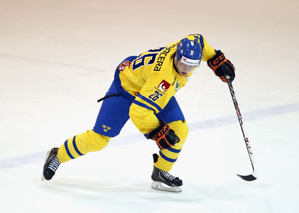 LAKE PLACID, NY - AUGUST 03:  Jakob Forsbaka-Karlsson #26 of Team Sweden skates against USA White during the 2014 USA Hockey Junior Evaluation Camp at the Lake Placid Olympic Center on August 3, 2014 in Lake Placid, New York.  (Photo by Bruce Bennett/Getty Images)