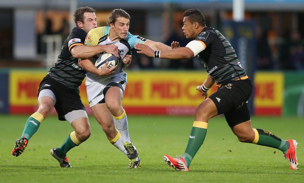 NORTHAMPTON, ENGLAND - OCTOBER 25:  Jeff Hassler of the Ospreys is tackled by Stephen Myler (L) and Luther Burrell during the European Rugby Champions Cup match between Northampton Saints and Ospreys at Franklin's Gardens on October 25, 2014 in Northampton, England.  (Photo by David Rogers/Getty Images)