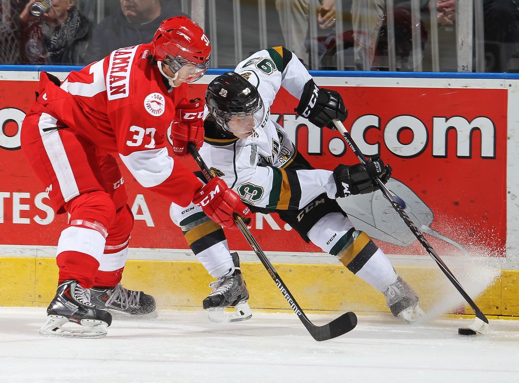 LONDON, ON - OCTOBER 31: Gustav Bouramman #37 of the Sault Ste. Marie Greyhounds battles against Mitchell Marner #93 of the London Knights in an OHL game at the Budweiser Gardens on October 31, 2014 in London, Ontario, Canada. (Photo by Claus Andersen/Getty Images)