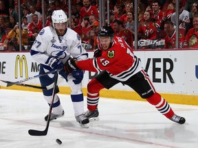 CHICAGO, IL - JUNE 10:  Jonathan Toews #19 of the Chicago Blackhawks battles for the puck against Victor Hedman #77 of the Tampa Bay Lightning during the second period of Game Four of the 2015 NHL Stanley Cup Final at the United Center on June 10, 2015 in Chicago, Illinois.  (Photo by Dave Sandford/NHLI via Getty Images)