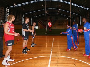 The Harlem Globetrotters learned some Aussie rules skills from the Essendon Bombers during their tour of Australia; apparently they've learned some rugby too.  (Photo by Robert Cianflone/Getty Images)