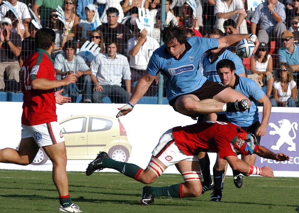 MONTEVIDEO, URUGUAY - MARCH 24:  Portuguese captain Vasco Uva #8 tackles fellow Uruguayan captain Rodrigo Capo-Ortega on March 24, 2007 in Montevideo, Uruguay. They advance on a 24-23 points aggregate. Portugal advances to the Rugby World Cup 2007 in France in spite of losing 18-12 and they advance on a 24-23 points aggregate.  (Photo by Ignacio Naon/Getty Images)