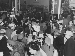 A busy Woodward's department store in September, 1955.
