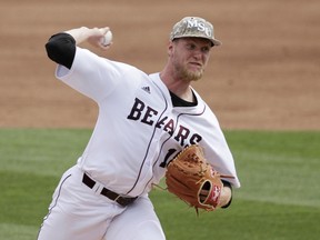 Missouri State pitcher Jon Harris throws against Arkansas during the second inning in a super regional of the NCAA college baseball tournament in Fayetteville, Ark., Friday, June 5, 2015. (AP Photo/Danny Johnston)