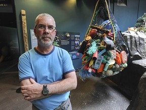 Tofino artist Peter Clarkson with his display of tsunami debris, collected on the shores of the west coast of Vancouver Island, at the Vancouver Aquarium. The display is part of World Oceans Day at the aquarium starting June 8.   (Jason Payne, PNG)