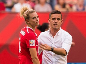 VANCOUVER, BC - JUNE 27: Lauren Sesselmann #10 of Canada is consoled by John Herdman Head Coach after losing 2-1 to England in the FIFA Women's World Cup Canada 2015 Quarter Final match between the England and Canada June, 27, 2015 at BC Place Stadium in Vancouver, British Columbia, Canada.  (Photo by Rich Lam/Getty Images)