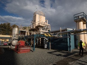 Rolf Lyster, FortisBC director of gas plant operations, walks through FortisBC’s existing Tilbury LNG facility before the groundbreaking for an expansion project in Delta in October 2014. According to the company, the $400-million expansion south of Vancouver will add 1.1 million gigajoules of liquefied natural gas to storage and 34,000 gigajoules per day of liquefaction capacity. The existing LNG facility on the site opened in 1971.
  (THE CANADIAN PRESS FILES)