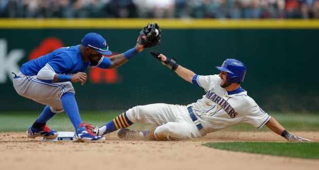 Chris Taylor of the Seattle Mariners is forced out at second base on a fielders choice by shortstop Jose Reyes of the Toronto Blue Jays in the sixth inning at Safeco Field on July 26, 2015 in Seattle, Washington.  (Photo by Otto Greule Jr/Getty Images)