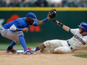 Chris Taylor of the Seattle Mariners is forced out at second base on a fielders choice by shortstop Jose Reyes of the Toronto Blue Jays in the sixth inning at Safeco Field on July 26, 2015 in Seattle, Washington.  (Photo by Otto Greule Jr/Getty Images)