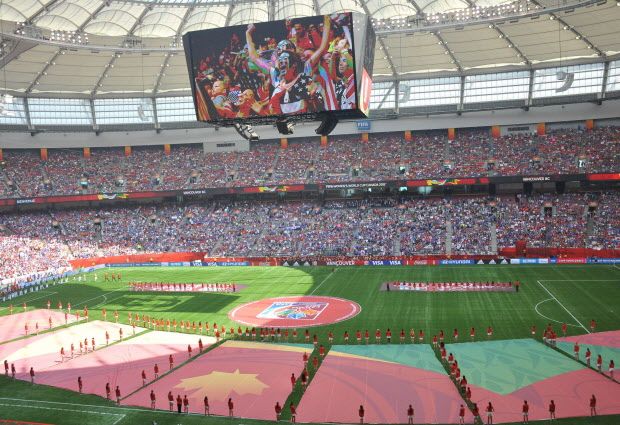 TOPSHOTS USA fans are seen cheering on the stadium display before the  2015 FIFA Women's World Cup final between the USA and Japan at BC Place Stadium in Vancouver, British Columbia on July 5, 2015.   AFP PHOTO/NICHOLAS KAMMNICHOLAS KAMM/AFP/Getty Images