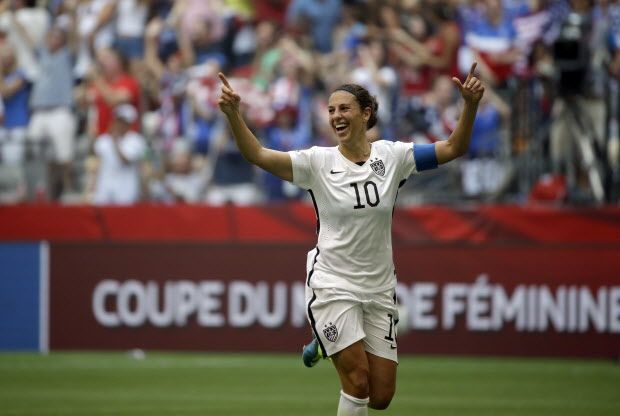 United States' Carli Lloyd celebrates after scoring her third goal against Japan during the first half of the FIFA Women's World Cup soccer championship in Vancouver, British Columbia, Canada, Sunday, July 5, 2015. (AP Photo/Elaine Thompson)