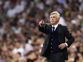 Italian coach Carlo Ancelotti coaching Real Madrid during the UEFA Champions League semi-final second leg football match vs Juventus at the Santiago Bernabeu stadium in Madrid on May 13, 2015. (GERARD JULIEN/AFP/Getty Images)