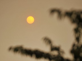 Smoke from west coast forest fires has turned the sky brown, and extended so far inland that the sun, hanging in the eastern sky just an orange glow from The Province's downtown Vancouver offices on the morning of July 5, 2015.     (Photo by Wayne Leidenfrost/PNG)