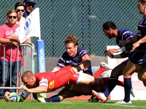 Canadian Nick Blevins scores against USA (Don MacKinnon/AFP/Getty Images