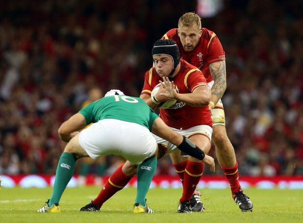 Ireland’s Rory Best (L) tackles Wales’s prop Nicky Smith during during the 2015 Rugby World Cup warm up rugby union match between Wales and Ireland at The Millennium Stadium in Cardiff, south Wales on August 8, 2015. The 2015 Rugby World Cup begins on September 18, 2015, and will be held at various venues across England and Wales. GEOFF CADDICK/AFP/Getty Images