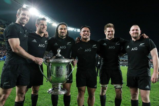 L-R: Conrad Smith, Dan Carter, Ma'a Nonu, Keven Mealamu, Richie McCaw and Tony Woodcock pose with the Bledisloe Cup after the All Blacks won against Australia during the Bledisloe Cup rugby union match between the Australian Wallabies and New Zealand All Blacks in Auckland on August 15, 2015.   AFP PHOTO / FIONA GOODALLFiona GOODALL/AFP/Getty Images