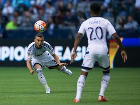 Russell Teibert and Deybi Flores in action against Olimpia in CONCACAF Champions League play. (THE CANADIAN PRESS/Darryl Dyck)