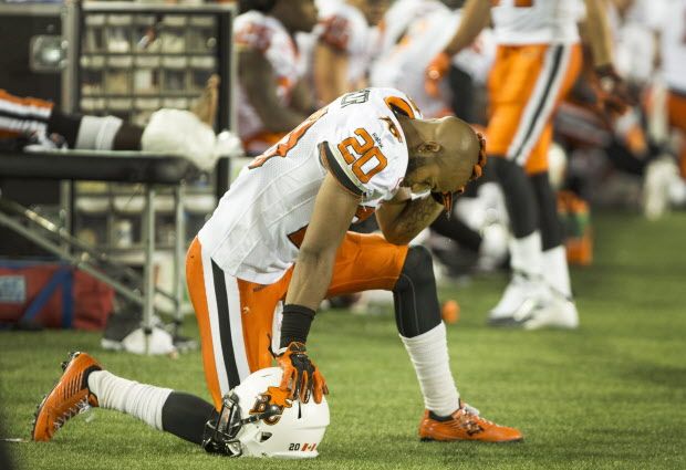 B.C. Lions safety Keynan Parker (20) takes a knee on the sidelines during the fourth quarter of CFL football action against the Hamilton Tiger-Cats in Hamilton on Saturday, August 15, 2015. The Tiger-Cats defeated the Lions 52-22. THE CANADIAN PRESS/Peter Power