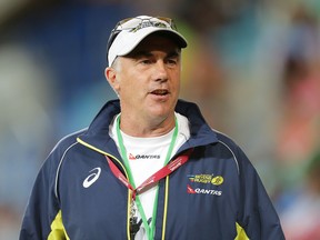 Australia coach Geraint John talks to players before the 2014 Gold Coast Sevens Pool C match between Australia and Fiji at Cbus Super Stadium on October 11, 2014 in Gold Coast, Australia.  (Photo by Mark Metcalfe/Getty Images)