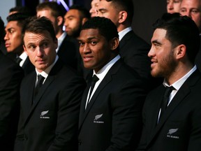 Ben Smith, Waisake Naholo and Nehe Milner-Skudder look on during the New Zealand All Blacks Rugby World Cup team announcement at Parliament House on August 30, 2015 in Wellington, New Zealand.  (Photo by Hagen Hopkins/Getty Images)