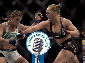 In this photo released by Inovafoto, Ronda Rousey, right, fights Brazil's Bethe Correia during their mixed martial arts bantamweight title fight at UFC 190, early Sunday, Aug. 2, 2015, in Rio de Janeiro, Brazil. Rousey knocked out Correia 34 seconds into the first round to win. (Alexandre Loureiro/Inovafoto via AP)