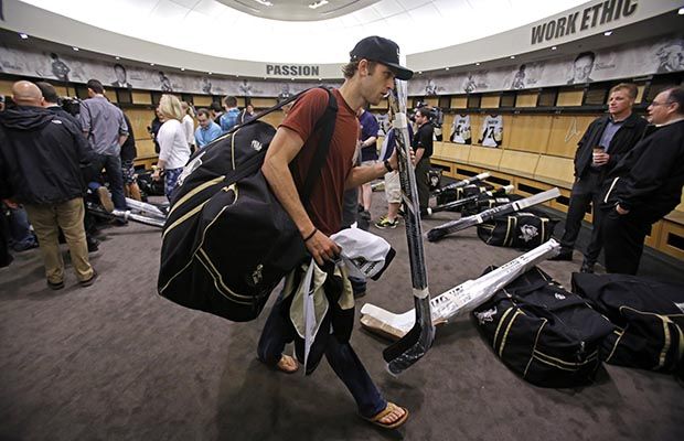 Brandon Sutter packs up his things following the 2014 playoffs in Pittsburgh. (AP Photo)