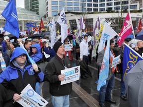 Delegates rallied outside the B.C. Federation of Labour convention in Dec. 2014, calling for a $15 per hour minimum wage for B.C. workers.