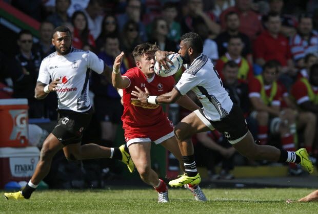 Fiji's scrum half Nikola Matawalu (L) is tackled by Canada's fly half Liam Underwood during the international rugby union friendly match between Canada and Fiji, ahead of the 2015 Rugby World Cup, at The Stoop in Twickenham, west of London, on September 6, 2015. AFP PHOTO / ADRIAN DENNISADRIAN DENNIS/AFP/Getty Images