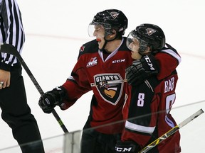 Tyler Benson and Alec Baer of the Vancouver Giants celebrates Baer's second goal against the Prince George Cougars during the first period of their WHL game at the Pacific Coliseum on October 18, 2014 . (Photo by Ben Nelms/Getty Images)