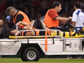 Wales' Leigh Halfpenny leaves the field on a stretcher  after getting injured during the rugby union World Cup warm up match at the Millennium Stadium, Cardiff, Wales Saturday Sept. 5, 2015.  (Joe Giddens/PA Wire via AP)