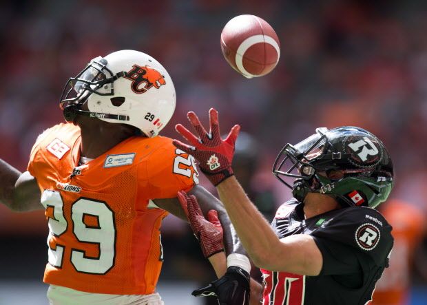 Ottawa Redblacks' Chris Williams, right, fails to make the catch in the end zone as B.C. Lions' Steven Clarke defends during the first half of a CFL football game in Vancouver, B.C., on Sunday September 13, 2015. THE CANADIAN PRESS/Darryl Dyck