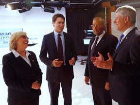 Canada's Green Party leader Elizabeth May, left to right, Liberal leader Justin Trudeau, New Democratic Party leader Thomas Mulcair and Conservative Prime Minister Stephen Harper confer before the Maclean's National Leaders debate in Toronto, August 6, 2015. THE CANADIAN PRESS/POOL-Mark Blinch
