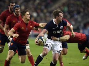 Scotland's fullback Stuart Hogg is tackled during the Six Nations international rugby union match between France and Scotland on February 7, 2015 at the Stade de France.