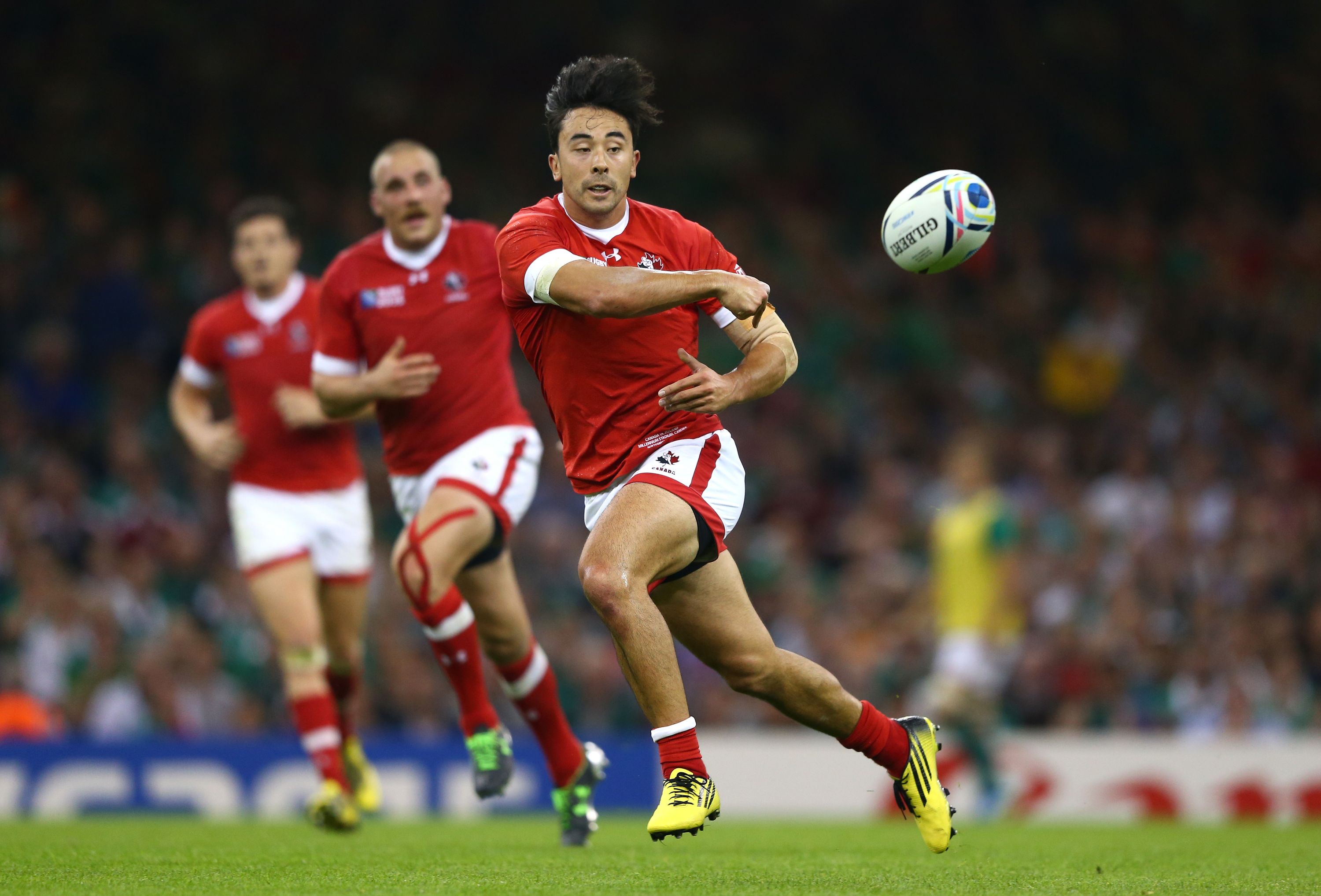 CARDIFF, WALES - SEPTEMBER 19:  Nathan Hirayama of Canada passes during the 2015 Rugby World Cup Pool D match between Ireland and Canada at the Millennium Stadium on September 19, 2015 in Cardiff, United Kingdom.  (Photo by Michael Steele/Getty Images)