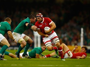 Jebb Sinclair of Canada takes on the Ireland defence during the 2015 Rugby World Cup Pool D match between Ireland and Canada at the Millennium Stadium on September 19, 2015 in Cardiff, United Kingdom.  (Photo by Laurence Griffiths/Getty Images)