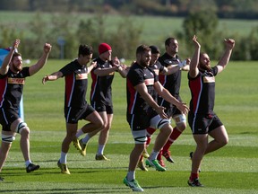 Canada's players warm up during a training session at Leicester Grammar School in Leicester on September 28, 2015, during the 2015 Rugby World Cup.  (BERTRAND LANGLOIS/AFP/Getty Images)