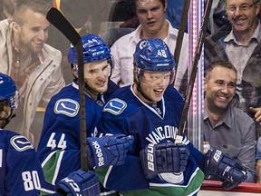 Hunter Shinkaruk is congratulated by Linden Vey after scoring a preseason goal in 2014. Shinkaruk is now one of many options available to the Canucks if Vey -- or anyone else -- doesn't perform.