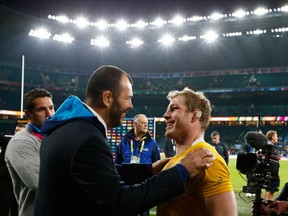 Michael Cheika congratulates David Pocock of Australia after winning the 2015 Rugby World Cup Semi Final match between Argentina and Australia at Twickenham Stadium on October 25, 2015 in London, United Kingdom.  (Photo by Dan Mullan/Getty Images)