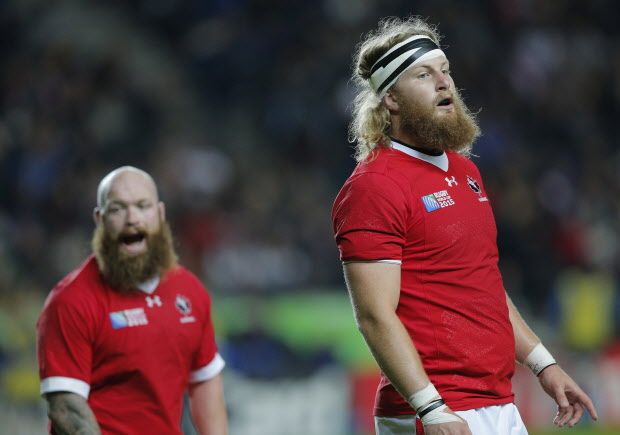 Canada's Evan Olmstead, right, and Ray Barkwill during the Rugby World Cup Pool D match between France and Canada at stadium:mk, Milton Keynes, England, Thursday, Oct. 1, 2015. (AP Photo/Christophe Ena)