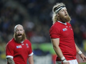 Canada's Evan Olmstead, right, and Ray Barkwill during the Rugby World Cup Pool D match between France and Canada at stadium:mk, Milton Keynes, England, Thursday, Oct. 1, 2015. (AP Photo/Christophe Ena)