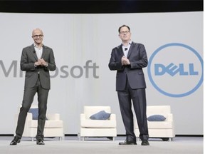 Satya Nadella, CEO of Microsoft, left, and Michael Dell announce a new better, faster and easier hybrid cloud at Dell World on Oct. 21 in Austin, Texas.