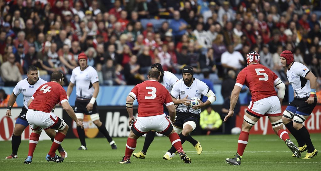 Romania's back row forward Viorel Lucaci (3R) runs with the ball during the Pool D match of the 2015 Rugby World Cup between Canada and Romania at Leicester City Stadium in Leicester, central England, on October 6, 2015.  AFP PHOTO / BERTRAND LANGLOIS RESTRICTED TO EDITORIAL USE, NO USE IN LIVE MATCH TRACKING SERVICES, TO BE USED AS NON-SEQUENTIAL STILLS        (Photo credit should read BERTRAND LANGLOIS/AFP/Getty Images)