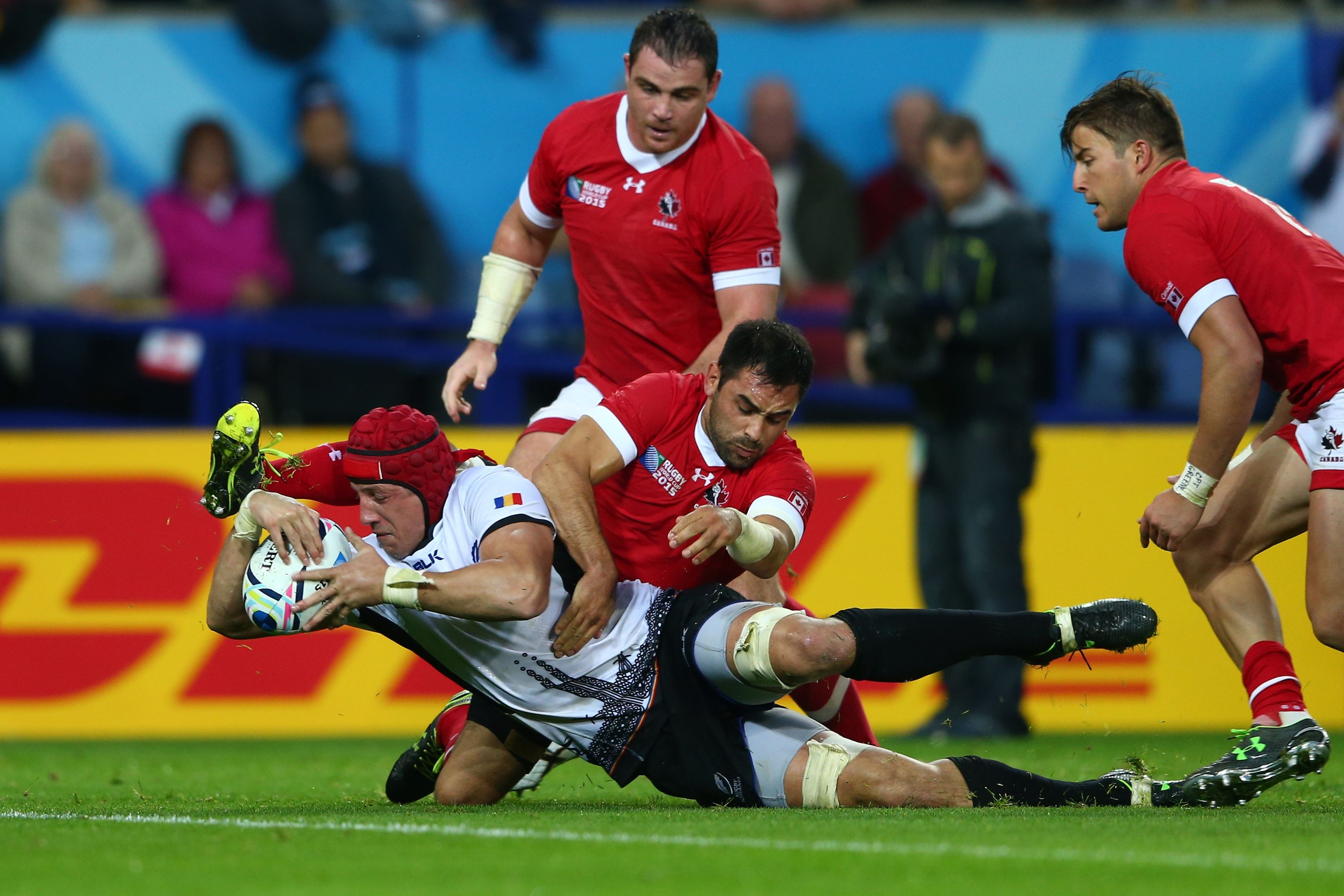 LEICESTER, ENGLAND - OCTOBER 06:  Mihai Macovei of Romania beats the Canada defence as he scores their second try during the 2015 Rugby World Cup Pool D match between Canada and Romania at Leicester City Stadium on October 6, 2015 in Leicester, United Kingdom.  (Photo by Michael Steele/Getty Images)
