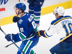 Jared McCann, left, celebrates a goal in front of St. Louis Blues' Scottie Upshall on Oct. 16.